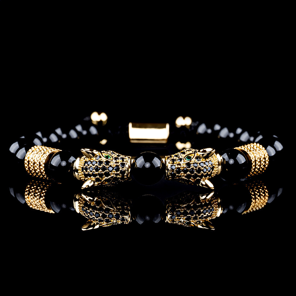 Testa di leopardo con diamante nero dorato