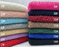 Tissu de dentelle de luxe entièrement perlé perles blanches et couleurs de tissu de broderie de perles en stock pour robe