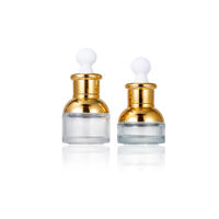 Bouteille de sérum d'huile essentielle en verre transparent de luxe de 30ml 50ml avec compte-gouttes dorés pour l'emballage de Carton de gouttes pour les yeux