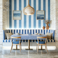Ensemble de mobilier pour café, restaurant, comprenant chaises demi-circulaires courbes, table et banquette.
