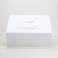 Étui de présentation rigide blanc magnétique personnalisé avec insert en satin noir rainuré pour bouteille, pour emballage de coffret d'essences, vente en gros