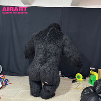 Costume de gorille réaliste en peluche gonflable d'activité de thème de carnaval de cirque en rouge pour le défilé