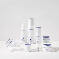 Ensemble cosmétique en verre exquis sur mesure haut de gamme, flacons pompe 40/100/120 ml, pot à crème 50 g avec bouchon bleu pour soins de la peau et essences