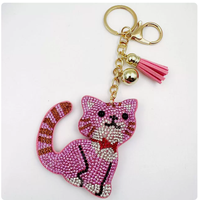 Porte-clés best-seller en forme de chat rose à longue queue, orné de strass étincelants et de pompons, idéal pour sacs et voitures