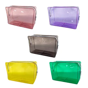 Pochettes de maquillage transparentes et étanches pour femmes avec logo personnalisé Trousse de toilette de voyage Trousse de maquillage transparente en PVC avec fermeture éclair