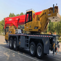 Grue mobile hydraulique STC800 pour camion de 80 tonnes, flèche télescopique de 80 000 kg, hauteur de levage de 68 m, moment de charge élevé, pompe, boîte de vitesses