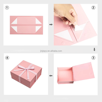 Boîte d'emballage cadeau pliable en rose avec logo personnalisé imprimé logo en relief pour parfums et cosmétiques en papier durable