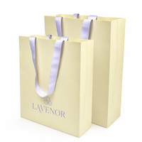 Sac cadeau en papier d'art noir brillant avec logo personnalisé et poignées en ruban – Emballage de luxe pour la vente au détail – Vente en gros directe usine