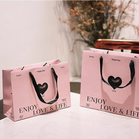 Sacs shopping en papier rose de luxe avec logo personnalisé et poignées en ruban, emballages cadeaux haut de gamme pour boutiques, vente en gros