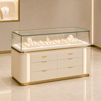 Vitrine de Luxe pour Bijoux avec Éclairage LED, Tiroirs de Rangement, Meuble de Comptoir Îlot Blanc Lait Doré pour Vente au Détail
