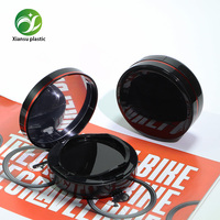 Boîte à coussin d'air ronde noire minimaliste en gros d'usine, emballage cosmétique vide personnalisable OEM/ODM