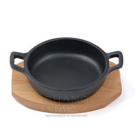 Vente de gros Plat à gratin rond en fonte Assiette Fajita avec socle en bois