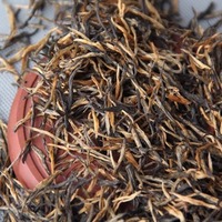 Vente en gros de thé noir Dianhong Gongfu de Yunnan Fengqing, à tige unique, aiguille dorée, bande droite, soie dorée, doux et parfumé