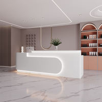 Comptoir de réception en bois de luxe avec incrustation de marbre pour boutique haut de gamme