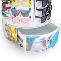 Présentoir rotatif pour lunettes de soleil avec miroir supérieur et tiroir inférieur. Support à lunettes avec porte-étiquettes et panneau publicitaire pour la vente au détail.