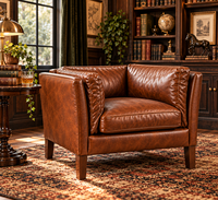 Fauteuil lounge vintage en cuir marron traditionnel avec coussin de dossier ergonomique, accoudoirs incurvés et un attrait intemporel pour la maison