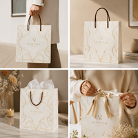 Sac de shopping pour chaussures en papier noir élégant et luxueux personnalisé, avec estampage à chaud doré, pour l'emballage de boutiques de mode haut de gamme