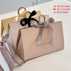 Luxury Shopping Paper <b>Bag</b> With Ribbon Handle Logo <b>Hot</b> Foiled Stamping Black Matt Paper <b>Bag</b> With Wood Ring and Ribbon Handle - Product Image 6