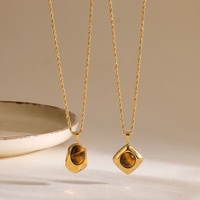 Collier pour femme en acier inoxydable style rétro, design géométrique irrégulier, avec pierre œil de tigre et bambou