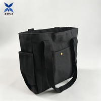 Sac fourre-tout en toile noire avec poche avant, rivets dorés, poche latérale et poignée en sangle assortie – Idéal pour le shopping, le travail quotidien et les voyages