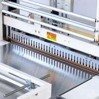 Machine d'emballage sous film rétractable semi-automatique pour emballages alimentaires et boissons
