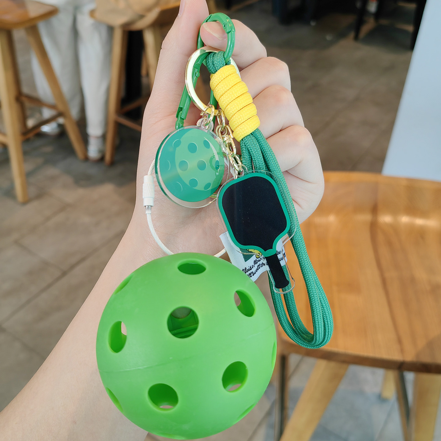 Green racket, green string, light green ball