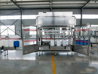 Machine de remplissage automatique de fûts à 4 têtes pour huile lubrifiante, avec pesage par gravité et bouchage
