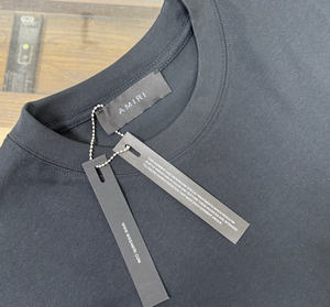 เสื้อยืดคอตตอนแท้พิมพ์ลายโฟมตัวอักษร Ami แบรนด์แฟชั่นยุโรปอเมริกา XX ทรงหลวม ระบายอากาศได้ดี สำหรับผู้ชายและผู้หญิง - Product Image 6