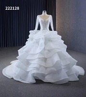 Feishiluo ivoire o-cou robe de bal de mariée moderne luxe perle dentelle robe de mariée avec des fleurs pour les femmes manches longues conception moelleuse