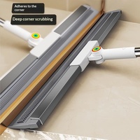 Nettoyeur multifonction avec lame en caoutchouc, manche en acier inoxydable, raclette en plastique pour sols et vitres, et balai.