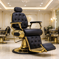 Fauteuil de Barbier de Luxe Noir Capitonnage Boutonné avec Cadre Métallique Doré, Inclinable Hydraulique et Pivotant à 360° pour Salon de Coiffure