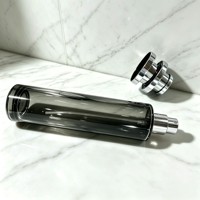 Flacon de parfum en verre transparent de 50 ml, forme ronde et longue, avec bouchon pulvérisateur argenté pour l'emballage d'huiles parfumées