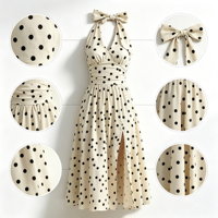 Robe rétro à pois avec nœud halter, col en V, taille froncée, fente latérale, longueur midi, idéale pour les fêtes estivales