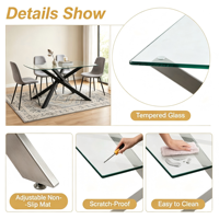 Table à manger moderne minimaliste de luxe avec plateau en verre trempé transparent, base en acier noir enduit de poudre, pieds en métal en forme de X