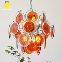 Lustre vintage en verre orange avec couches extérieures transparentes et cadre chromé pour salle à manger et salon rétro, style mid-century