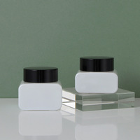 Vente en gros de pots en verre blanc vides pour crème avec couvercle noir, contenants cosmétiques rechargeables, emballage personnalisé avec logo