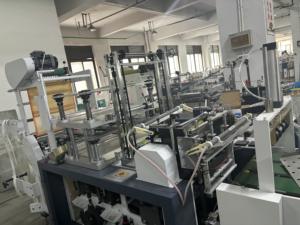 Macchina per la produzione di sacchetti per guanti multifunzione ad alta velocità per imballaggi efficienti - Product Image 2