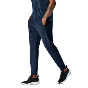 Pantalones deportivos para correr de hombre de alta calidad con logotipo personalizado al por mayor, pantalones deportivos de marca OEM de secado rápido con puños para sudor y fitness