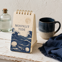 Carnet spirale LABON personnalisé « Mélange de Lune » avec couverture crème, reliure double spirale dorée, motifs vagues, lune pleine, perles et coquillages festonnés