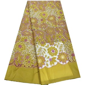 Tissu de broderie creux de luxe en dentelle de chrysanthème en stock du fabricant pour robes traditionnelles et sexy - Product Image 1