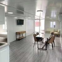 Conteneur magique américain à deux étages Petite maison préfabriquée Paquet plat Île solaire extensible Maison d'hôtel empilable 3 chambres à coucher
