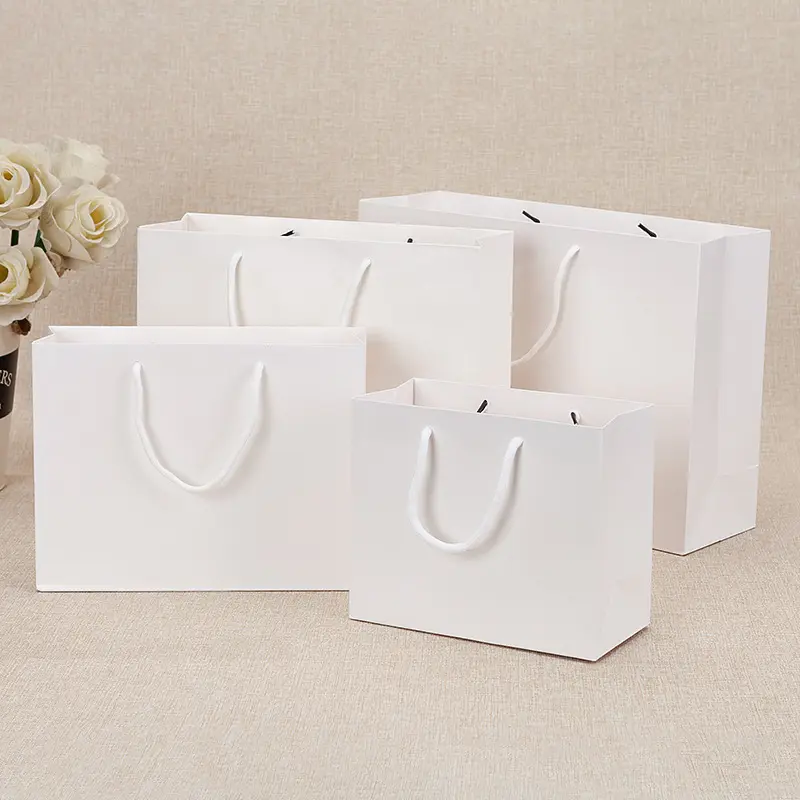 High Quality Gift Packaging Luxury Flat Bottom Kraft Paper Cardboard Paper Gift Bag for Clothes Shopping With Ribbon Handles