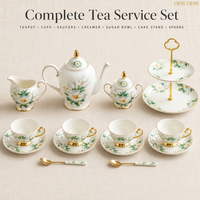 Service à thé en porcelaine fine Camélia Blanc avec bordure dorée, style Moyen-Orient, portable, comprenant théière, tasses, soucoupes, sucrier, crémier, support à gâteau, cuillère et coffret cadeau