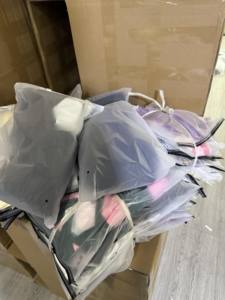Used Clothing Bundles in Transparent Bags for Resale or <b>Donation</b> - Product Image 1