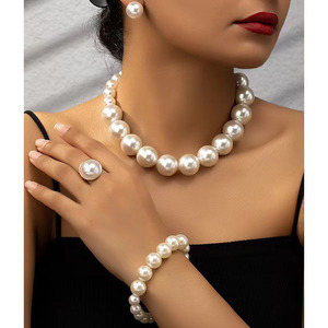 Juegos de joyas de perlas de plástico al por mayor 2025 juegos de joyas de boda ecológicas de alta calidad para mujeres