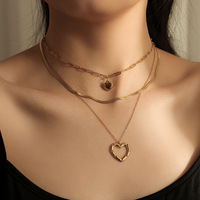 Nouveau Style multicouche en acier inoxydable chaîne cubaine collier plaqué or amour pendentif os chaîne collier pour femmes cadeau