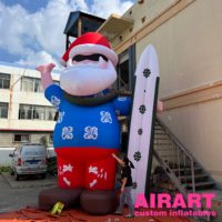 Père Noël gonflable géant sur planche de surf hawaïenne, Père Noël gonflable personnalisé de qualité commerciale pour la plage