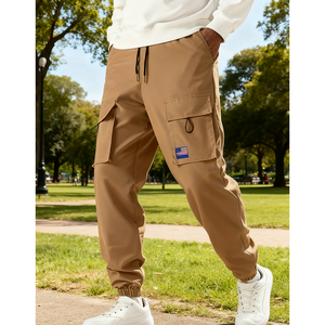 Nouveau pantalon cargo pour homme à poches et cordon de serrage, couleur unie, de Chine, en stock aux États-Unis, ample, décontracté, tendance et polyvalent - Product Image 1