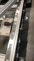 Transportador de Cadena de Rodillos Acumuladores para Línea de Ensamblaje de Automóviles Eléctricos en Planta de Fabricación