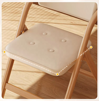 Fauteuil pliant avec dossier et assise rembourrés, revêtement en cuir PU, structure en acier carbone, finition grain de noyer, empilable, style rétro pour salle à manger